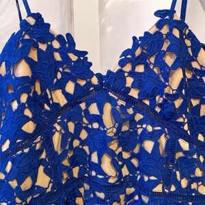 Blue with pink dress, has been used it’s good condition